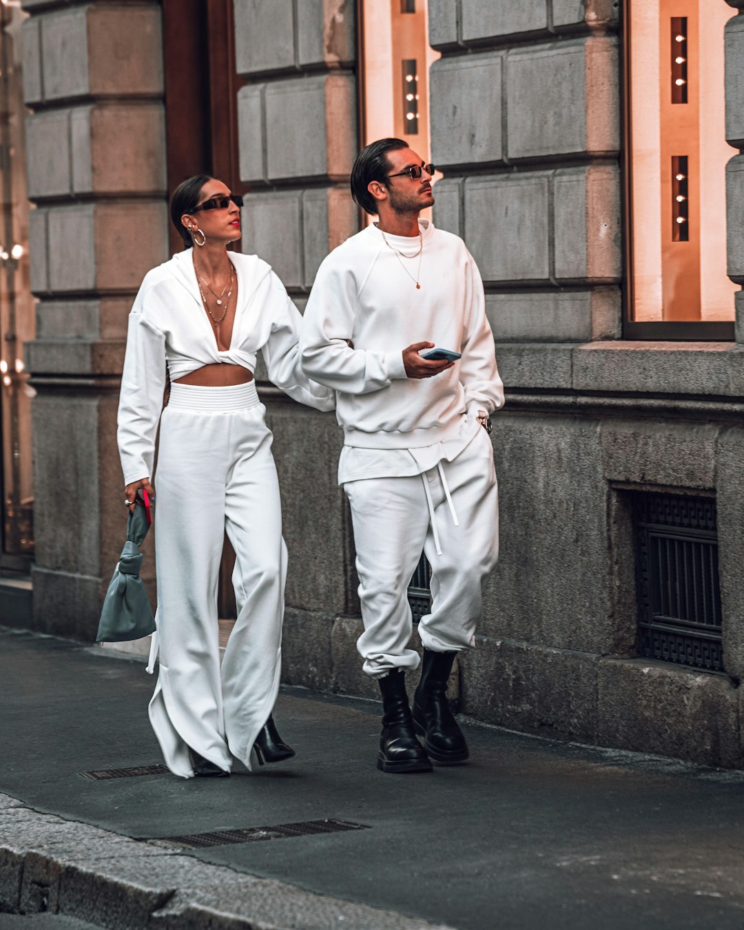 Fashion model wearing a tailored camel coat on an Antwerp street