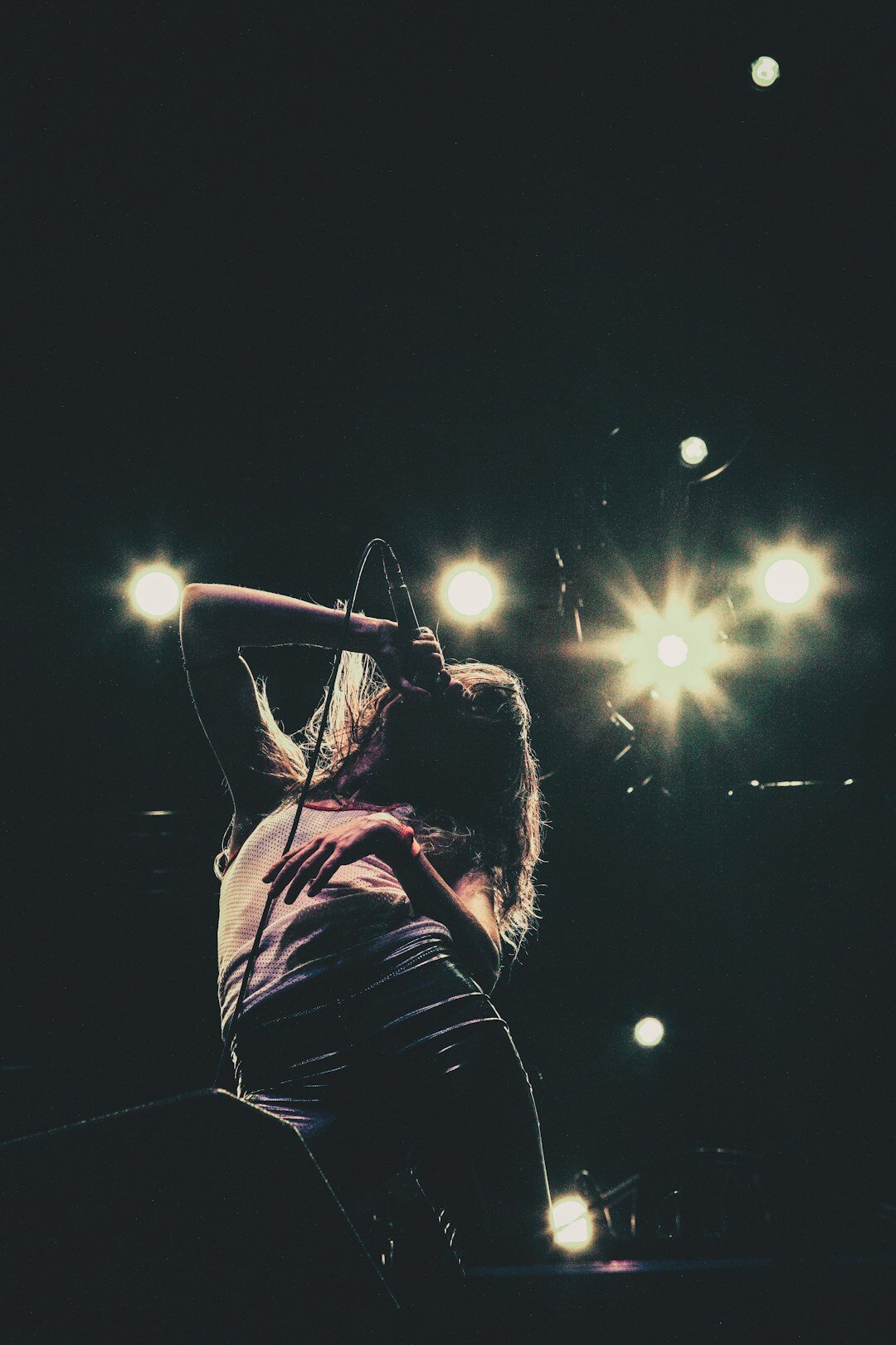 singer performing on stage